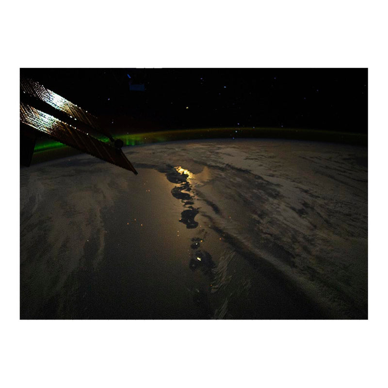 ISS Photograph of Aurora Borealis and Moonglint Shining Over the Aleutian Islands, AK Jigsaw Puzzle